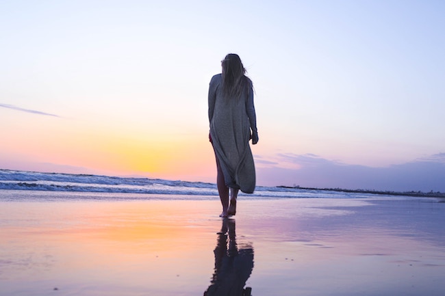 woman standing on beach front