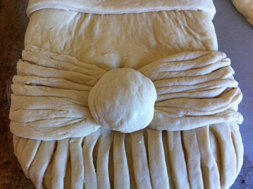 dough ball for nose attached to Santa bread