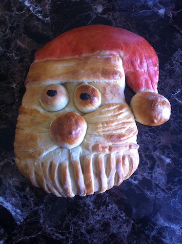 bread shaped in the face of santa