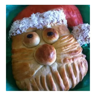 bread shaped in the face of santa clause