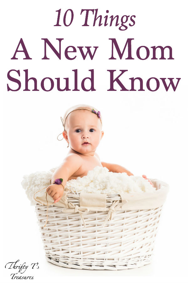 baby girl sitting in a white basket