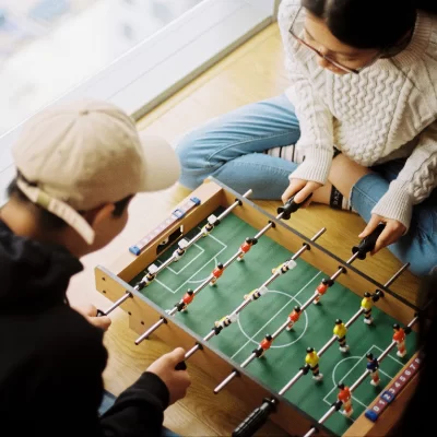 couple playing mini foosball