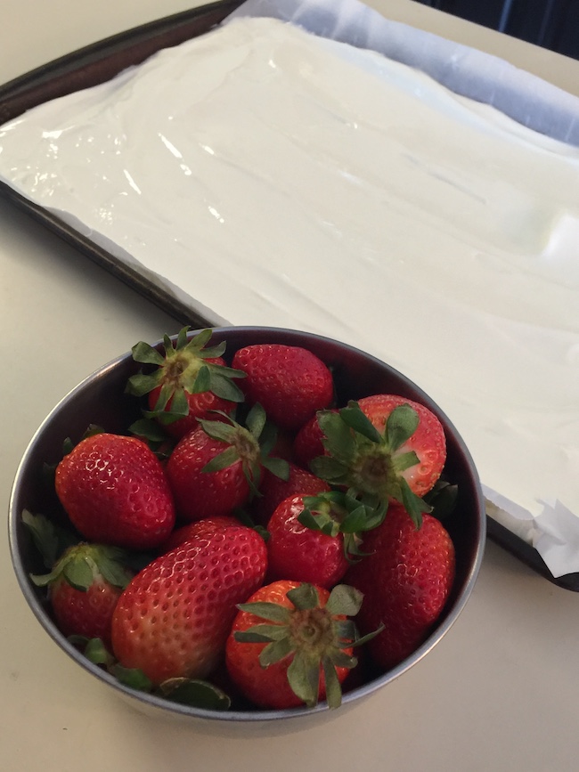 bowl of strawberries and pan with yogurt