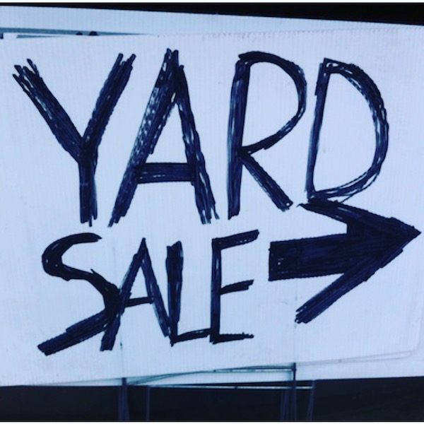 yard sale sign with arrow