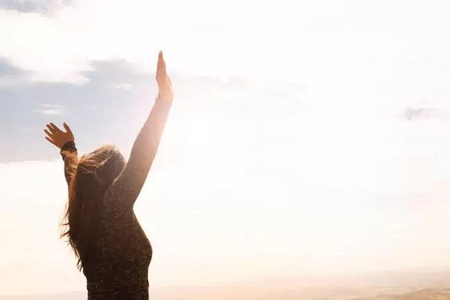 woman with outstretched arms