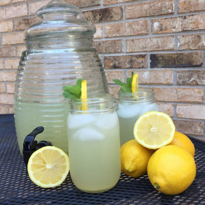 glasses of lavender lemonade in front of pitcher