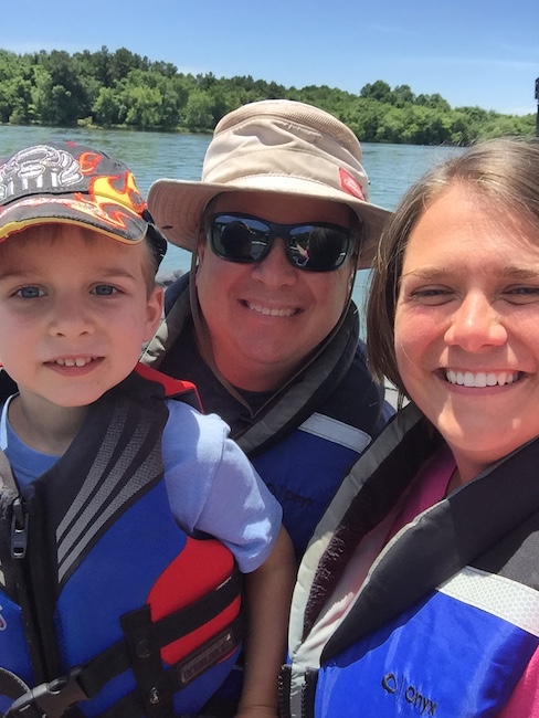 dad, mom and son in life vests
