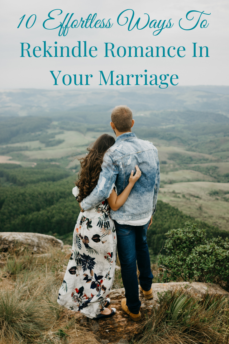 couple arm in arm on mountaintop