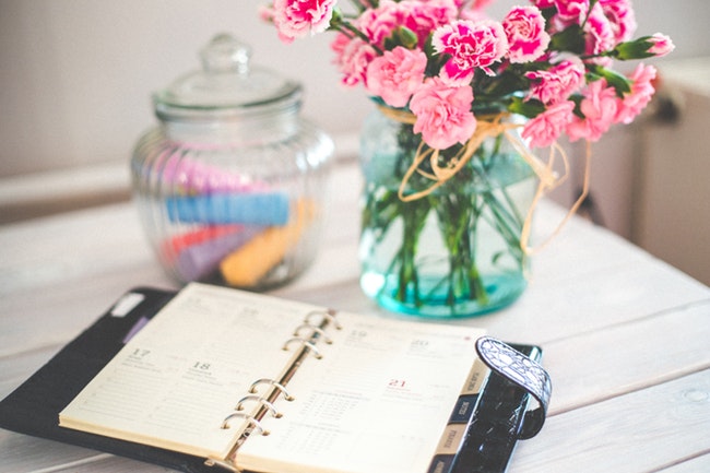 table with calendar and flowers