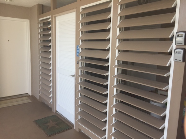 condo door with slats for front porch area