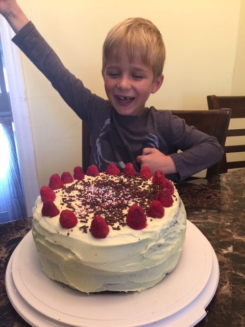 little boy with birthday cake