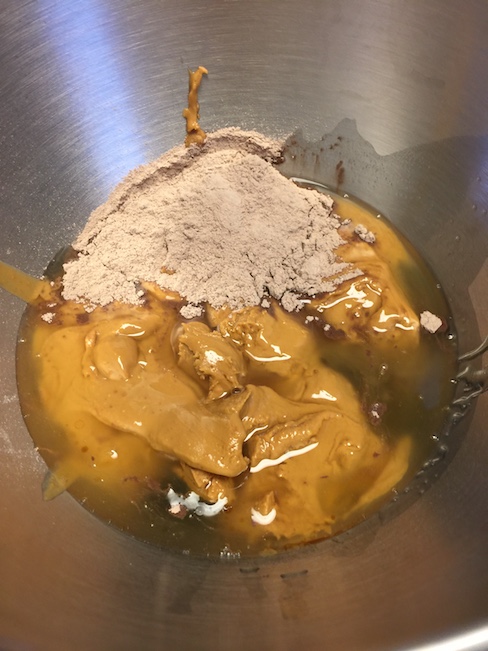 peanut butter, protein powder, honey and vanilla ready to be mixed together