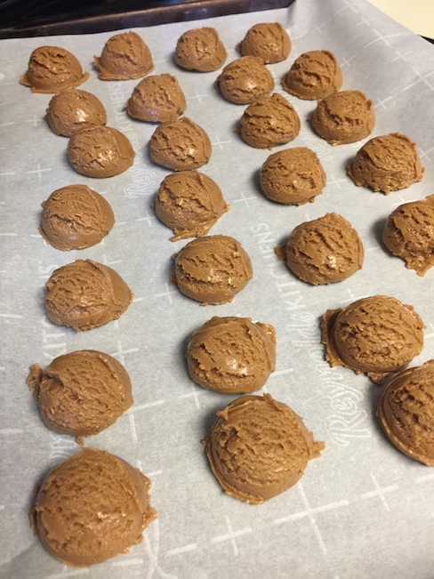 peanut butter balls ready to be dipped In chocolate