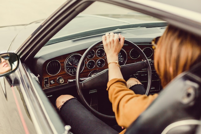 woman sitting in drivers seat