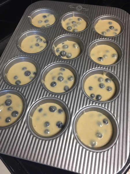 blueberry muffin mix in muffin pan