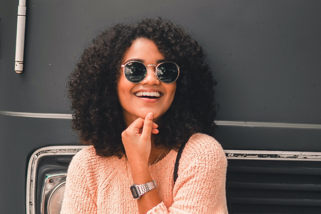 smiling woman wearing sunglasses