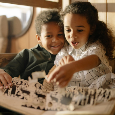 black children reading a pop up book