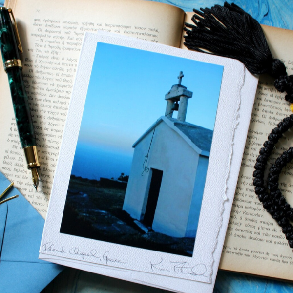 greeting card of a church on top of a book