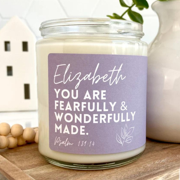 white candle with lilac label