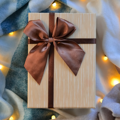light brown gift with dark brown bow