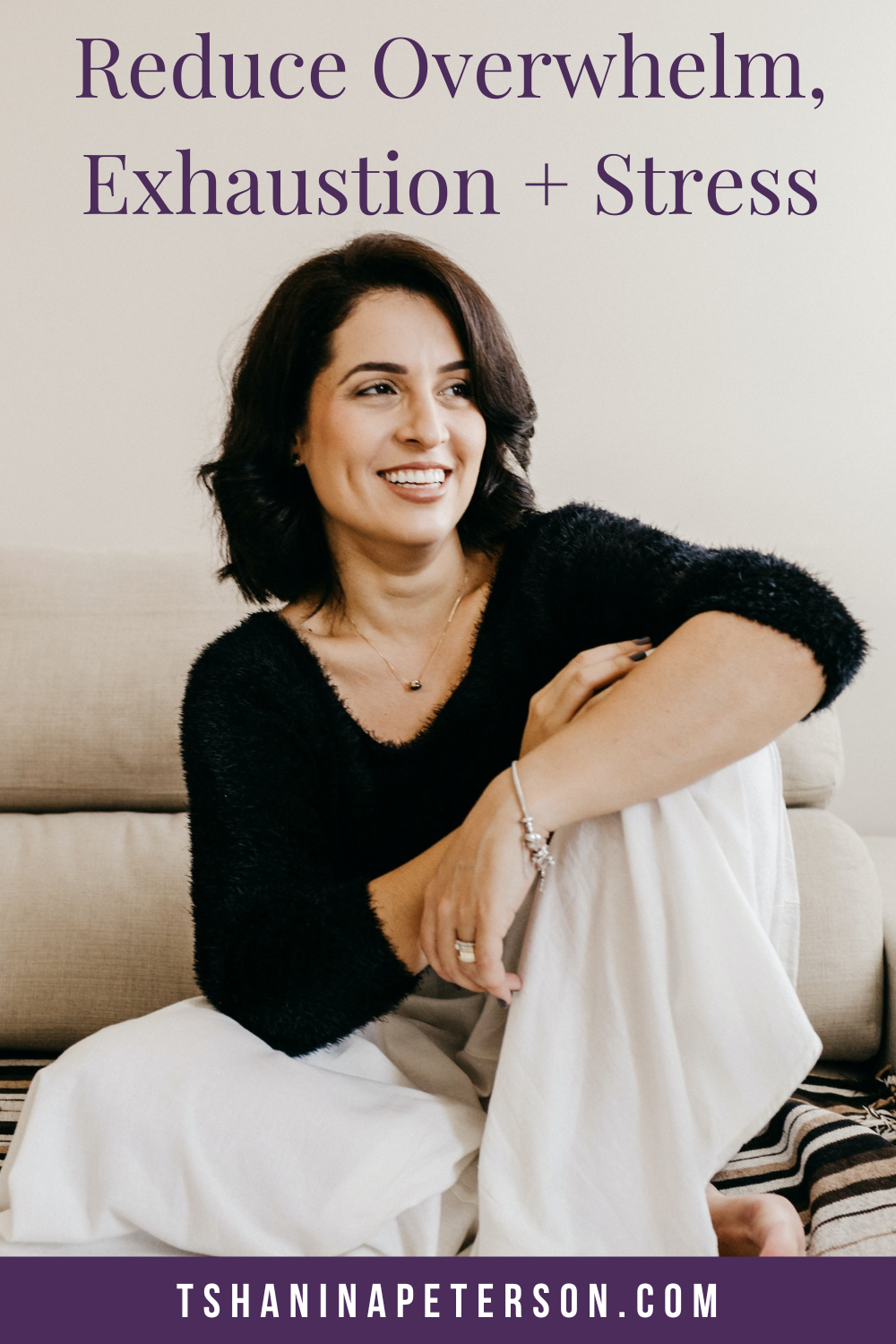 smiling woman sitting on couch