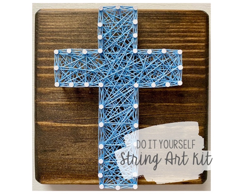 nails in the shape of a cross with blue string going back and forth to nails to make a beautiful design