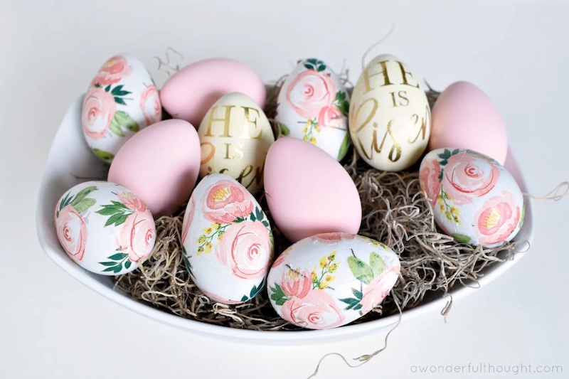 Easter decoupage eggs that are pink, cream with gold He is Risen words and pink flowers on a white egg - these are a fun easter craft for adults and kids