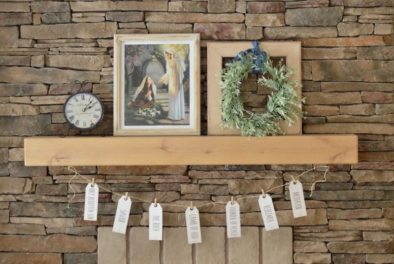 string banner with the names of Jesus on the tags hanging from a mantle - a simple yet meaningful christian easter craft for the family to enjoy