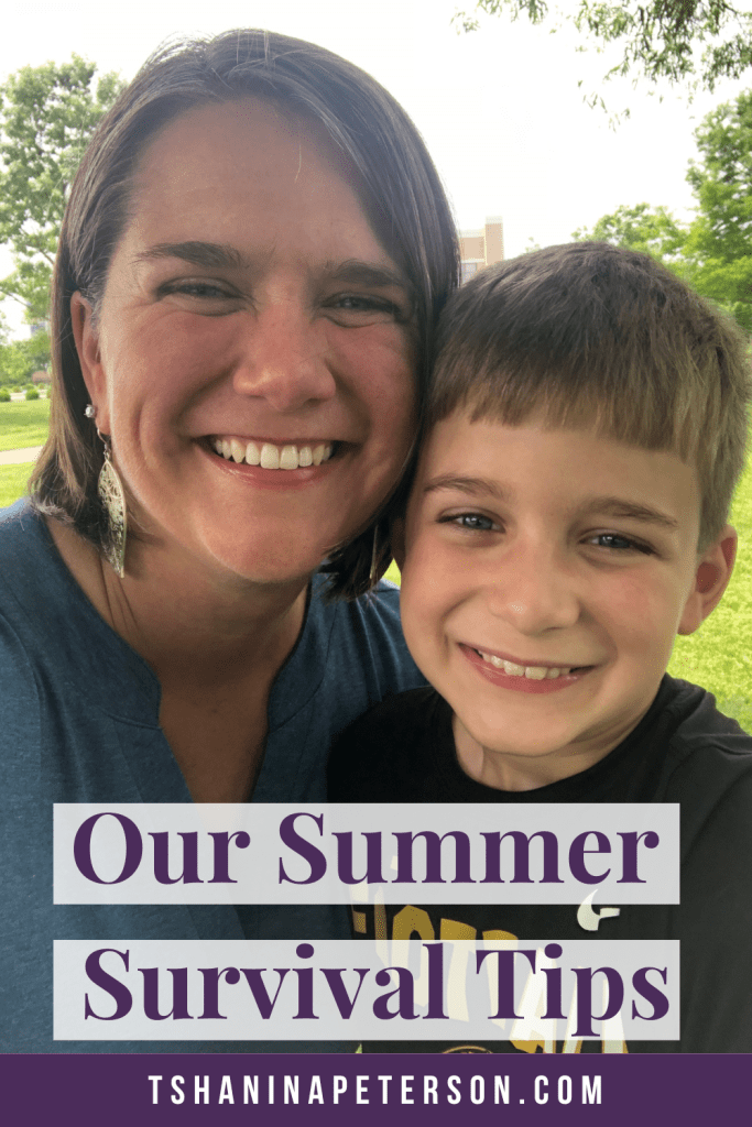 smiling mom and son standing outside