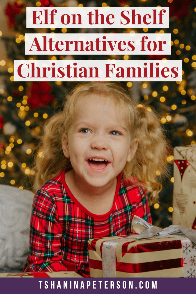 happy little girl in front of christmas tree