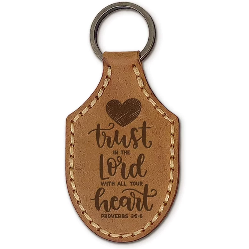 leather keychain with a heart and the words trust in the Lord with all your heart