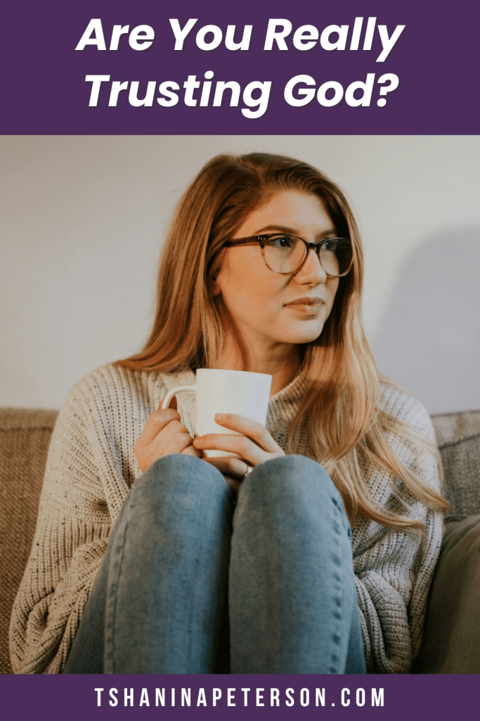 woman sitting on couch holding a coffee cup